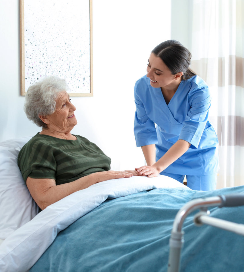 caregiver taking care of senior woman